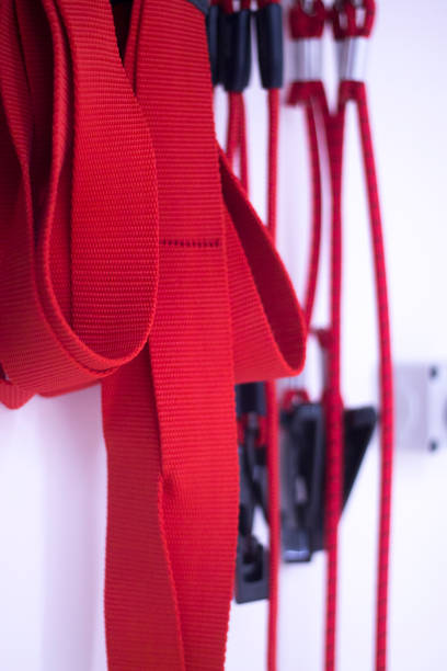 istock Suspension training physical therapy exercise equipment with red cord gravity bodyweight resistance workout. 844245604