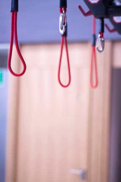 istock Suspension training physical therapy exercise equipment with red cord gravity bodyweight resistance workout. 844245822