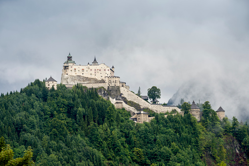 Werfen, Austria – August 12, 2017: The castle of Hohenwerfen on a rainy and foggy day.