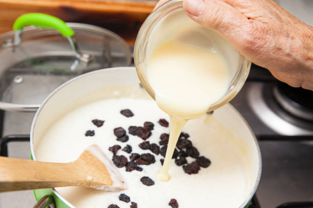 istock Adding sweetened condensed milk to the cooked rice 844264796