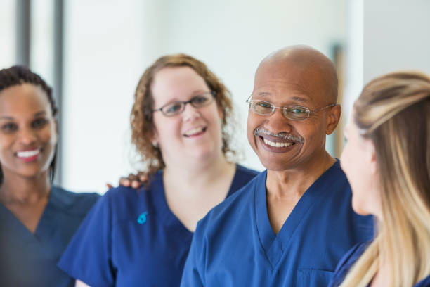 istock Man leading team of multi-ethnic medical professionals 844272106