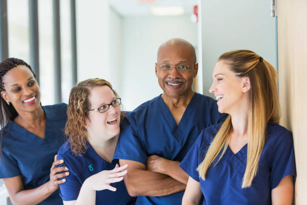 istock Man leading team of multi-ethnic medical professionals 844272172