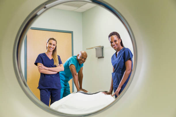 istock Multi-ethnic medical team with CT scanner 844272298
