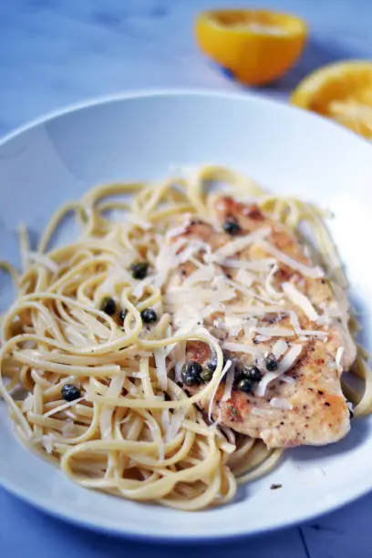 Simple Lemon Chicken Piccata with fresh meyer lemons paired with buttery linguine noodles.