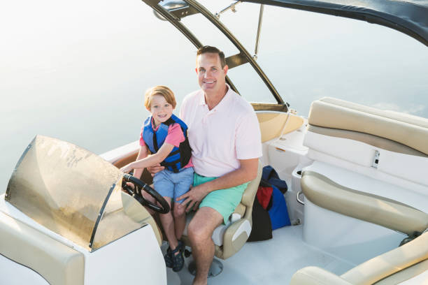 istock Father and son on boat 844297258