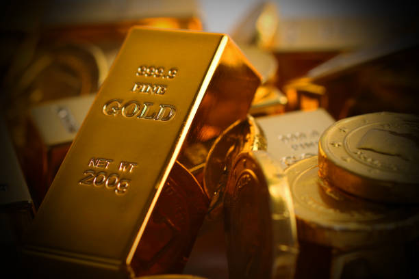 istock Gold coins with gold ingot 844297476
