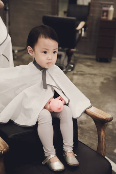 istock Toddler child getting her first haircut 844300596