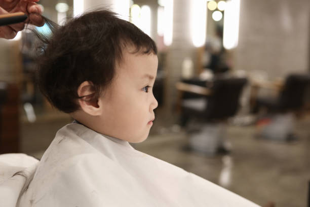 istock Toddler child getting her first haircut 844300604
