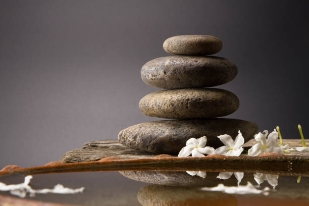 istock Spa with stack of ston and water in bathtup 844300656