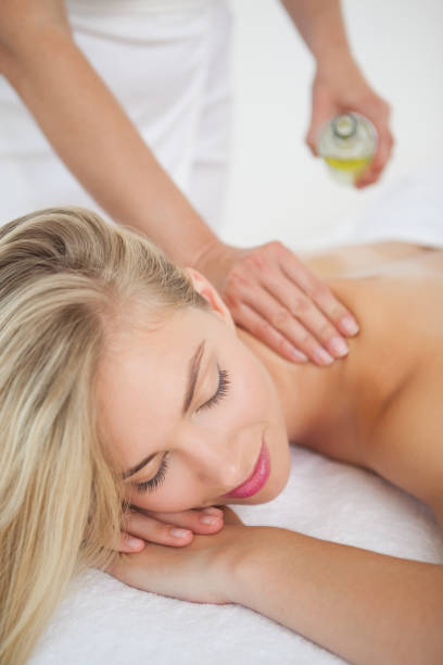 istock Beautiful blonde enjoying a back massage 844309180
