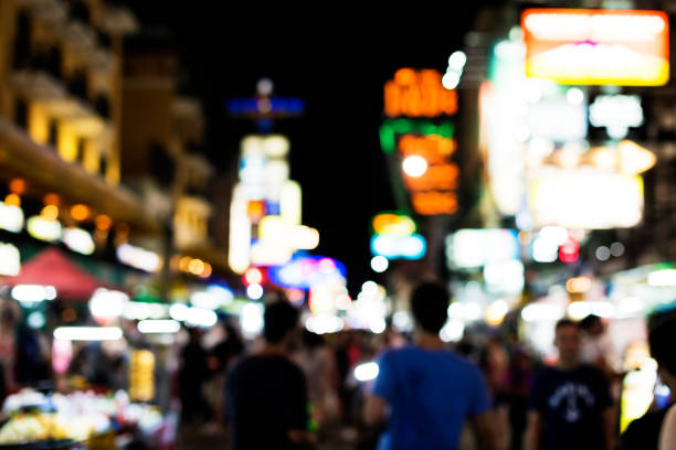 istock Blurred street market lights at night time 844309218