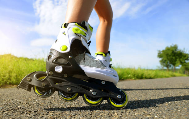 istock Female legs in inline skates. 844312260