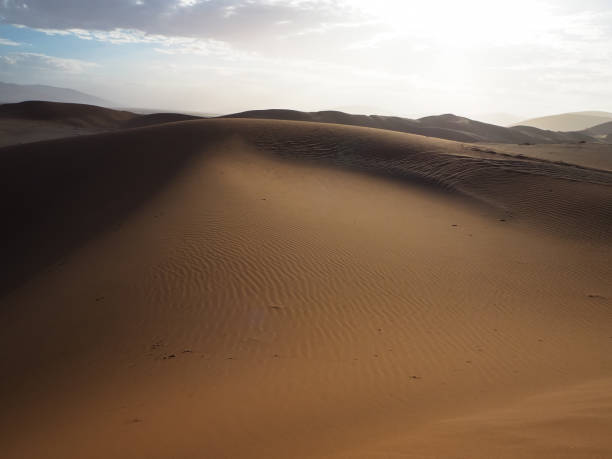 istock Soft natural rusty red sand dune and bright sky of vast desert landscape copyspace background with hot sunlight, Sossus, Namib desert 844314926