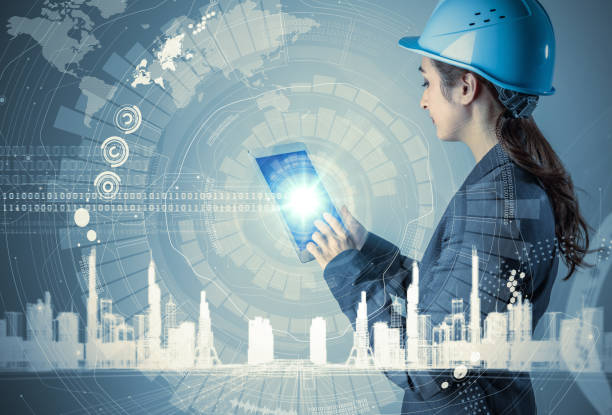 istock young woman engineer holding tablet PC. industrial technology concept. abstract mixed media. 844315096