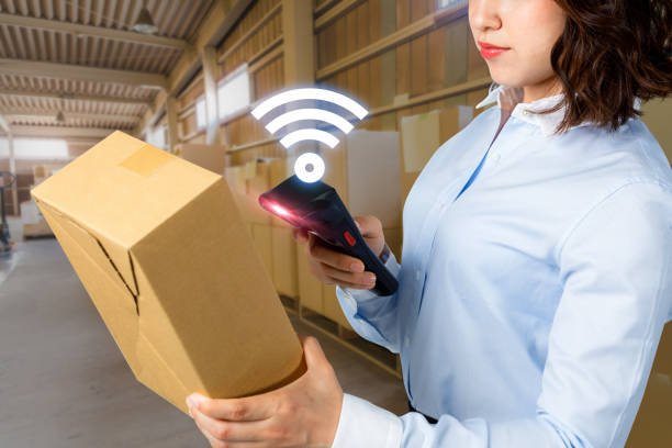 young woman using tablet PC in warehouse. industrial technology concept. factory automation. Industry4.0 young woman using tablet PC in warehouse. industrial technology concept. factory automation. Industry4.0 radio frequency identification stock pictures, royalty-free photos & images