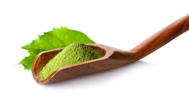 istock green tea powder in scoop on white background 844326710