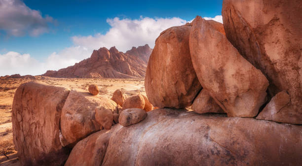 istock Large granite boulders of varying sizes in foreground with mountains in background. Spitzkoppe, Namib Desert, Namibia. 844327232