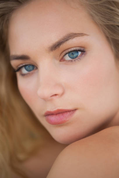 istock Beautiful natural blonde looking at camera 844332730
