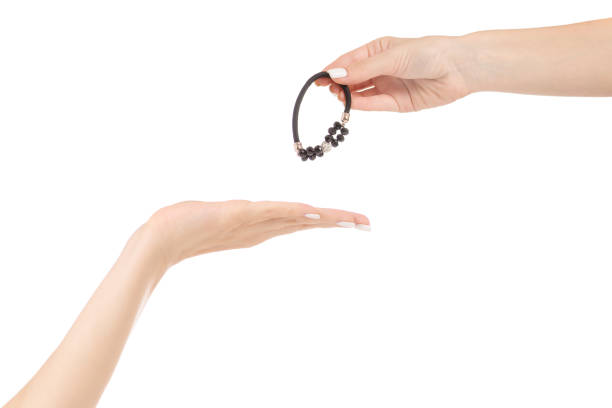 istock Female hand passes hair clip 844335222