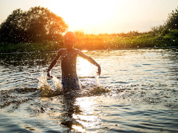 istock kids having fun at lake 844338128