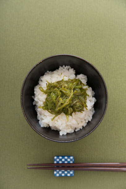 istock Warm steamed rice topped with Mekabu (a type of tender wakame seaweed) 844338222