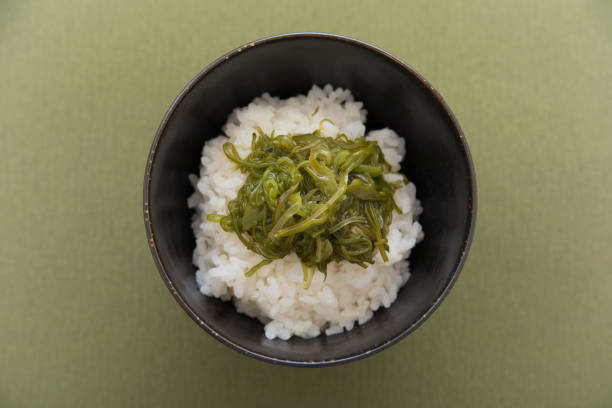 istock Warm steamed rice topped with Mekabu (a type of tender wakame seaweed) 844339982