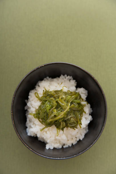 istock Warm steamed rice topped with Mekabu (a type of tender wakame seaweed) 844340770