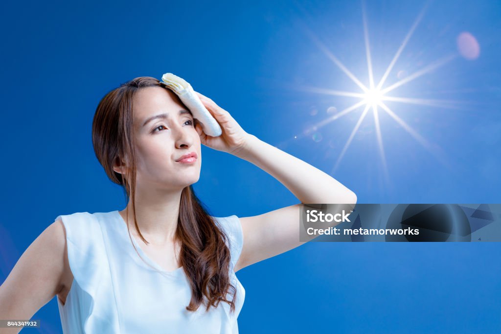 sunlight and heatstroke concept. Heat - Temperature Stock Photo