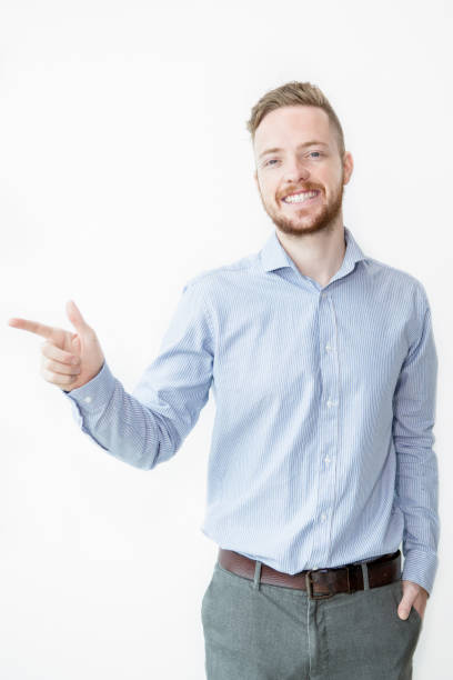 istock Smiling Man Pointing Finger Away 844345248