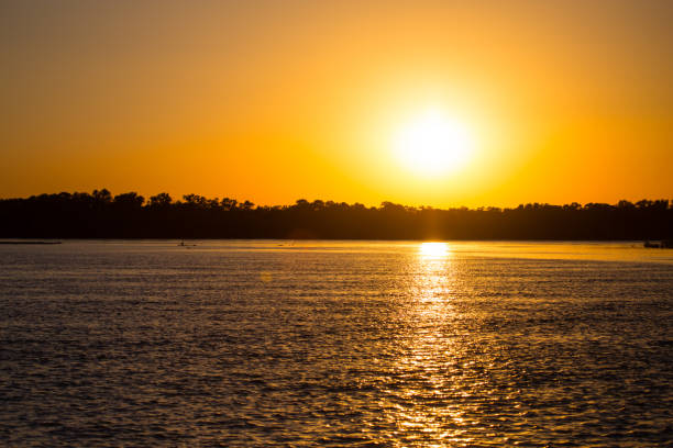 istock golden sunset on a river in the nature 844346772