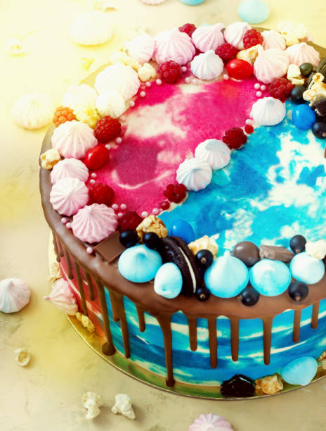 istock Bright celebratory cake double blue and pink with meringue and chocolate 844353278