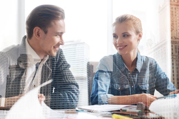 istock Positive colleagues working together in the office 844356912