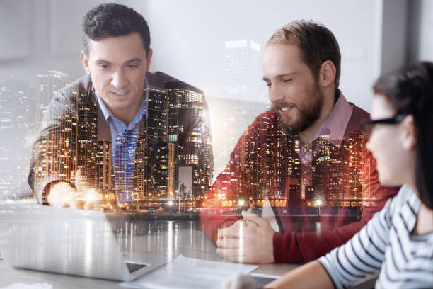 istock Positive professional man discussing a new project with his colleagues 844360390