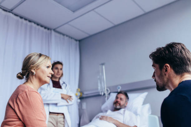 istock Family visiting hospitalised man 844360516