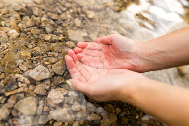 istock water in the spring in the hands 844360792
