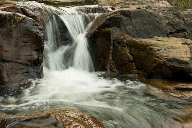 istock Beautiful waterfalls in the green forest. 844364312