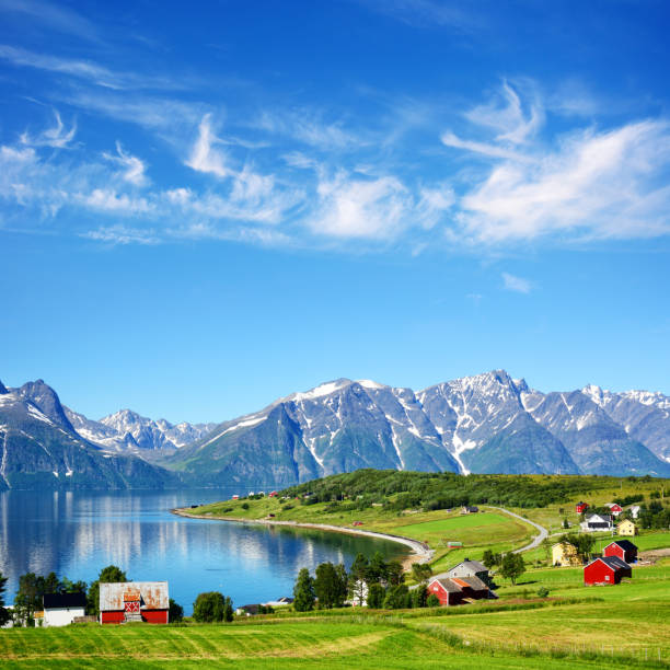 Djupvik village, Norway Lyngen fjord and Lyngen Alps on backgrond in Troms county, Norway. Composite photo fjord stock pictures, royalty-free photos & images