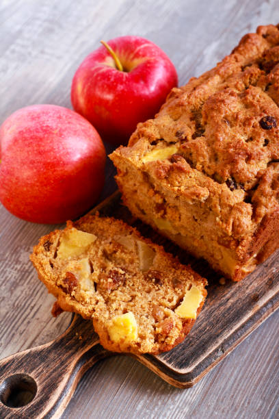 istock Apple and raisin cake, sliced on board 844364980
