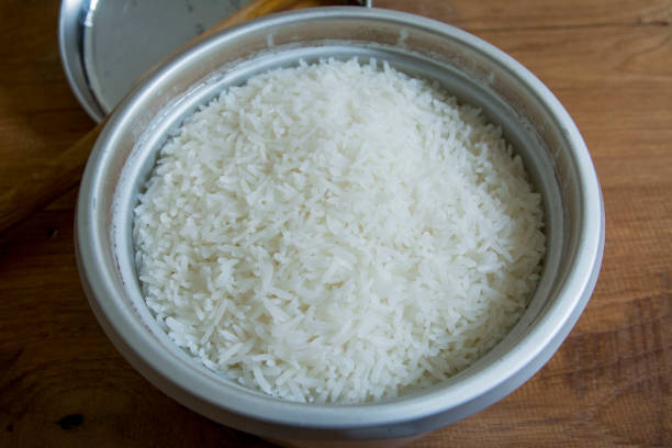 istock Cook rice in a pot on a wooden table 844365358