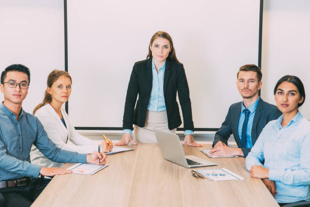 istock Serious Female Boss and Stuff in Conference Room 844368282