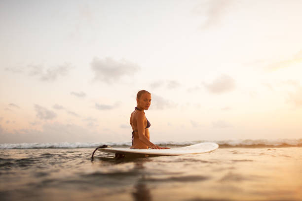 istock young surfer woman 844371886