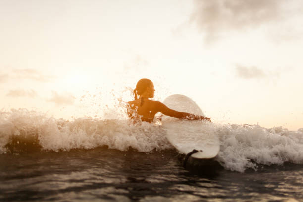 istock young surfer woman 844371888