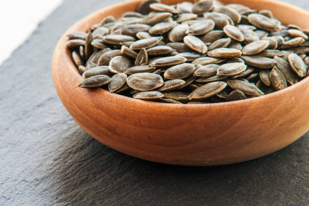 istock Full bowl of pumpkin seeds close up 844372096