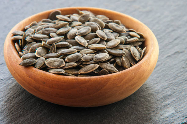 istock Full bowl of pumpkin seeds close up 844372130