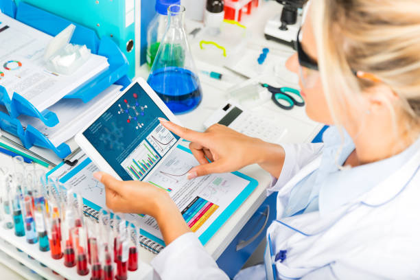istock Young attractive woman scientist using tablet computer in the laboratory 844374312