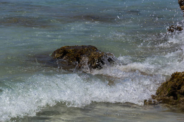 istock rock in the middle of the sea2 844378470