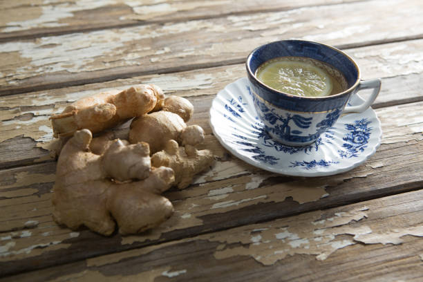istock High angle view of fresh gingers by tea with lemon slice on table 844378836
