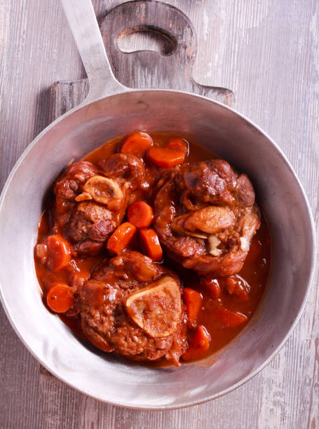 istock Osso buco (braised veal shank) with vegetables and gravy. 844379160