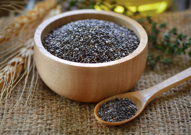istock Chia seeds in wood bowl 844381982