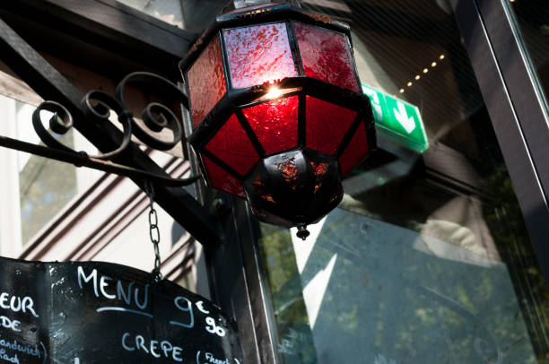 red lantern and menu sign outside a Parisian bistrot